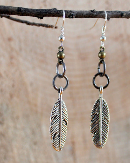 silver feather mixed metal earrings